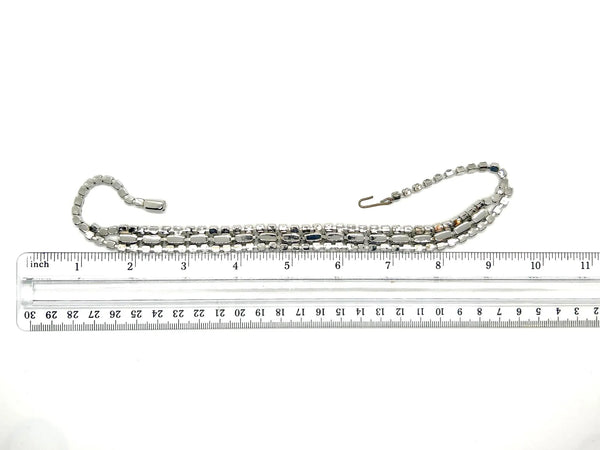This is a beautiful vintage rhinestone necklace or choker set with a line of sideways baguettes in black paired with meticulously prong-set round white rhinestones on top and bottom.