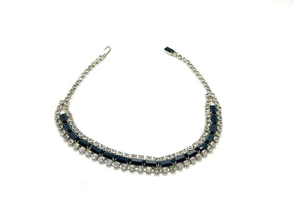 This is a beautiful vintage rhinestone necklace or choker set with a line of sideways baguettes in black paired with meticulously prong-set round white rhinestones on top and bottom.