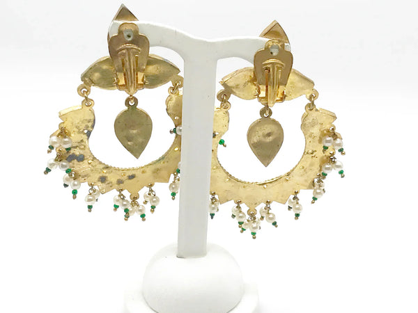 Get ready to make a statement with a pair of stunning earrings that effortlessly combine legance of Moghul style and boldness. Each clip on earring features an alternating pattern of dramatic pear-shaped green and clear stones, along with a striking green drop that is beautifully accented with faux pearl and green beads. 