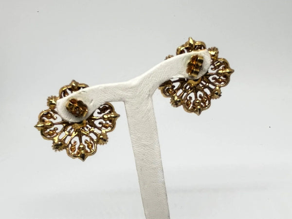 These filigreed vintage red earrings offer an exquisite aesthetic, beautifully detailed with pink, purple, and red chaton rhinestones in a square pattern. Meticulously designed, each earring's dimensions measure 3/4" square. 