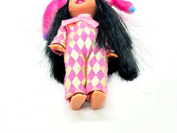 Jester Jenny doll wearing a pink and white checkered outfit with a matching hat on a white background