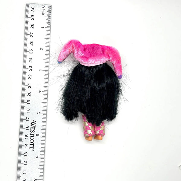Jester Jenny doll wearing a pink and white checkered outfit with a matching hat on a white background