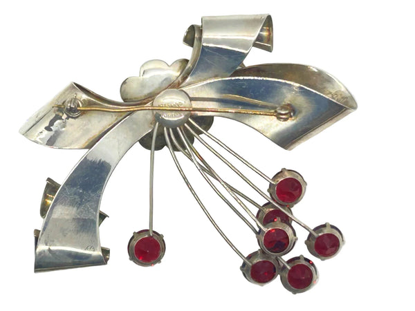 Perfect for vintage jewelry lovers: our Sterling by Jordan 1940s Red Stone Vintage Bow Brooch provides timeless elegance with striking red stones. Shop today!