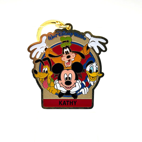 Vintage Walt Disney World You're Special enamel keychain featuring Mickey Mouse, Goofy, Pluto, and Donald Duck with a personalized Kathy nameplate