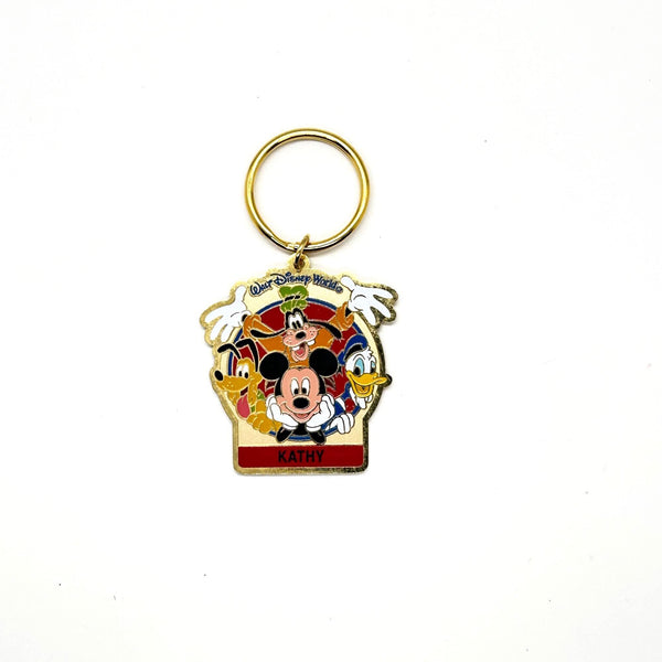 Vintage Walt Disney World You're Special enamel keychain featuring Mickey Mouse, Goofy, Pluto, and Donald Duck with a personalized Kathy nameplate