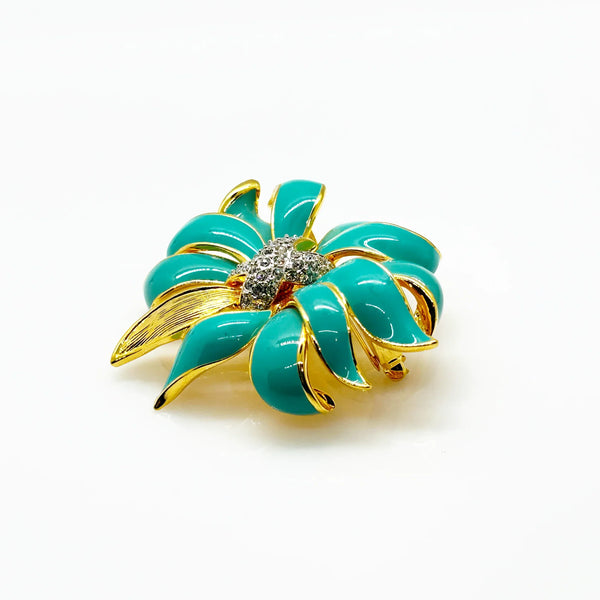 Perfect for vintage jewelry collectors: our KJL Fleur Moderne Brooch provides bold turquoise enamel and sparkling rhinestone glamour. Shop today!