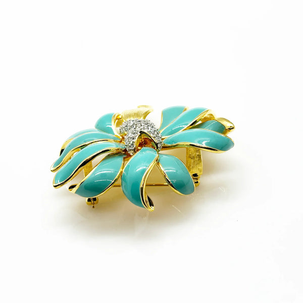 Perfect for vintage jewelry collectors: our KJL Fleur Moderne Brooch provides bold turquoise enamel and sparkling rhinestone glamour. Shop today!
