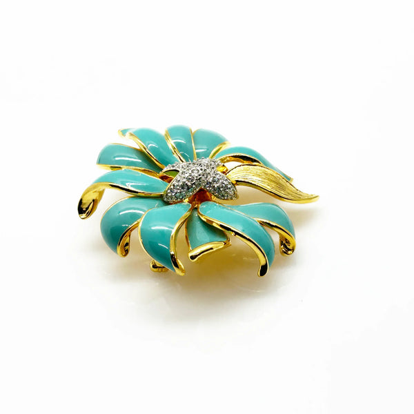Perfect for vintage jewelry collectors: our KJL Fleur Moderne Brooch provides bold turquoise enamel and sparkling rhinestone glamour. Shop today!