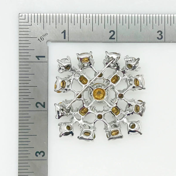 This splendid vintage rhinestone brooch made in a lacy design of bright white round and oval rhinestones. The setting is silver tone metal and measures 1 1/2" wide. The condition is very good. It can be worn sideways or vertically, and looks wonderful either way. The stones have excellent fire and clarity, full of eye catching glitter.