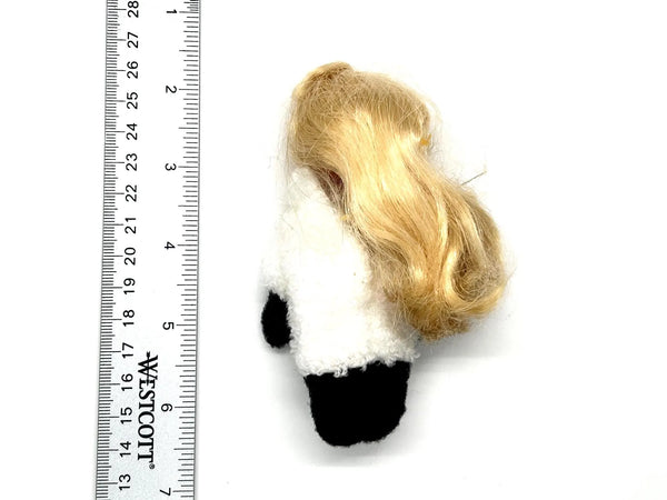 Back of a vintage miniature doll with long blonde hair, a white sherpa-style fleece top, and black feet, ideal for identification and replacement parts listing