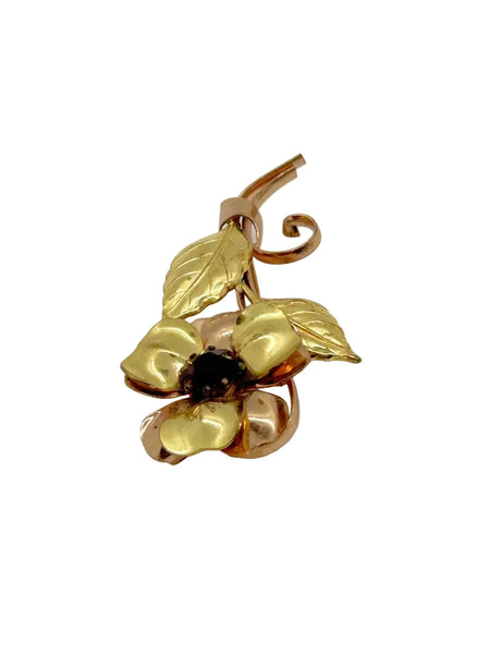 Bring a touch of vintage glamour to any outfit with this stunning, handmade flower brooch. Its beautifully crafted copper and gold petals and leaves surround a sparkling purple center, making it a striking statement piece that will surely turn heads.
