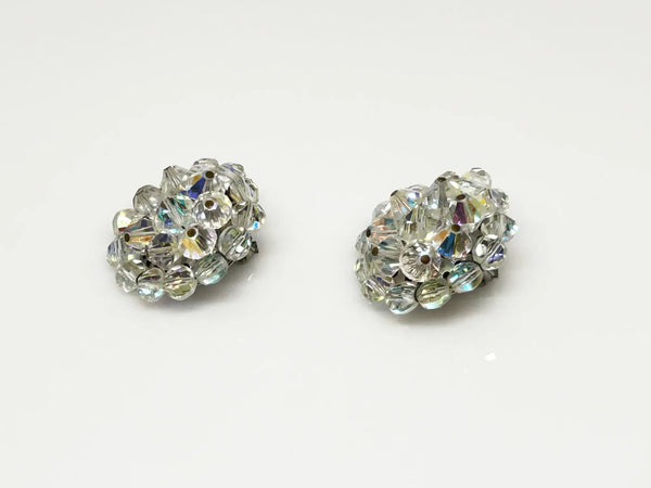 These vintage earrings are so bright and sparkling that it's hard to capture. They retain all of the colorful reflections of light despite the passage of time. There are three layers of hand wired round bead, and from every angle, there is sparkle.