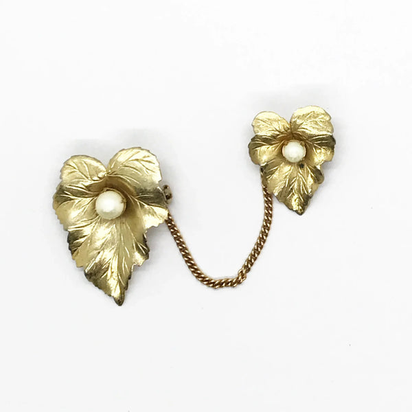 Discover the charm of mid-century elegance with this authentic pair of&nbsp; Sarah Coventry "Chit-Chat" sweater guards from the late 1950s.