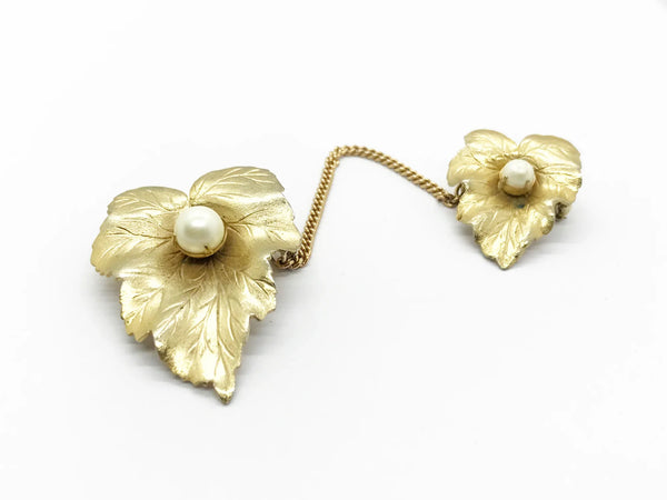 Discover the charm of mid-century elegance with this authentic pair of&nbsp; Sarah Coventry "Chit-Chat" sweater guards from the late 1950s.