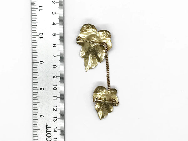 Discover the charm of mid-century elegance with this authentic pair of&nbsp; Sarah Coventry "Chit-Chat" sweater guards from the late 1950s.