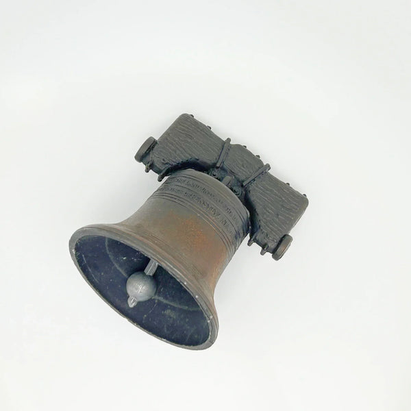Bring a touch of American history to your home with this charming, miniature metal replica of the iconic Liberty Bell. Standing at a delightful 2.5 inches tall, this piece beautifully captures the essence of freedom and independence, a symbol that has resonated since the American Revolution.