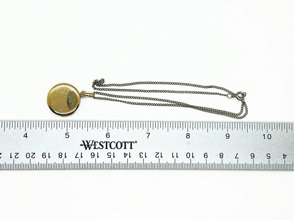 This timeless piece from the late 1960s features carefully engraved detailing on the front and a sleek, polished back. The locket has enough space for two treasured photos or any other keepsake of your choice