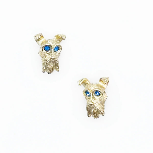 These vintage dog face pins are the perfect accessory for any animal lover! With detailed and expert craftsmanship, each pin showcases the adorable face of a terrier or schnauzer, complete with captivating blue eyes.