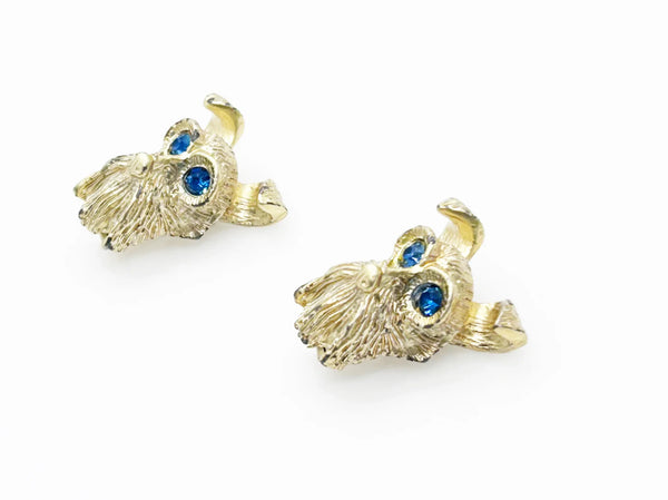 These vintage dog face pins are the perfect accessory for any animal lover! With detailed and expert craftsmanship, each pin showcases the adorable face of a terrier or schnauzer, complete with captivating blue eyes.