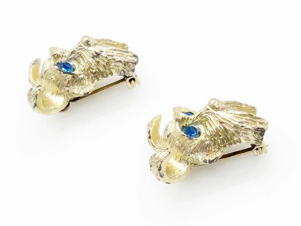 These vintage dog face pins are the perfect accessory for any animal lover! With detailed and expert craftsmanship, each pin showcases the adorable face of a terrier or schnauzer, complete with captivating blue eyes.