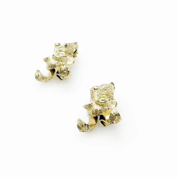 These vintage dog face pins are the perfect accessory for any animal lover! With detailed and expert craftsmanship, each pin showcases the adorable face of a terrier or schnauzer, complete with captivating blue eyes.