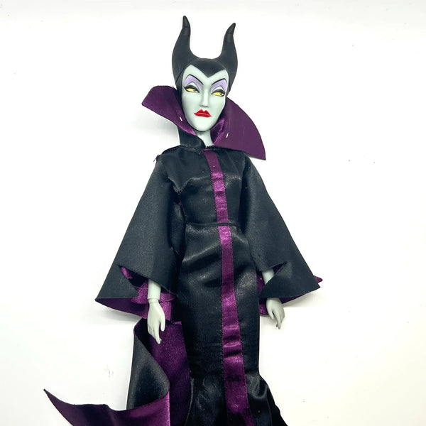 Disney Store Maleficent 12-inch classic fashion doll wearing her iconic black and burgundy robe with curved horns headpiece, isolated on a solid white background.