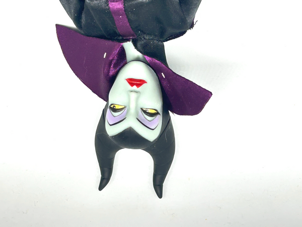 Disney Store Maleficent 12-inch classic fashion doll wearing her iconic black and burgundy robe with curved horns headpiece, isolated on a solid white background.