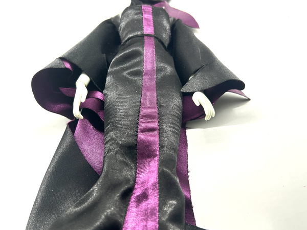 Disney Store Maleficent 12-inch classic fashion doll wearing her iconic black and burgundy robe with curved horns headpiece, isolated on a solid white background.