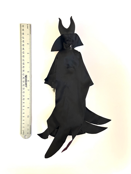 Disney Store Maleficent 12-inch classic fashion doll wearing her iconic black and burgundy robe with curved horns headpiece, isolated on a solid white background.