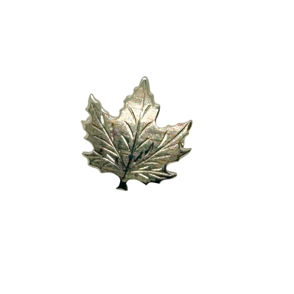 Add a touch of vintage charm to your wardrobe with this delightful silver maple leaf pin! This little beauty- measuring just 1" across- showcases intricate etching that brings the iconic leaf to life, complete with a textured finish that catches the light beautifully.