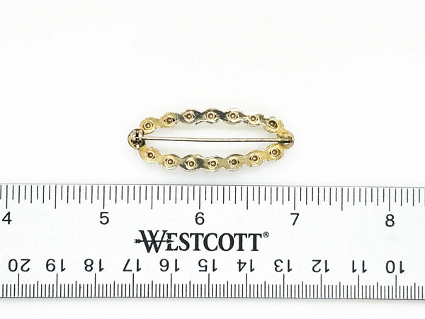 Perfect for fashion enthusiasts seeking subtle sophistication: our elegant vintage marquise shaped faux pearl brooch provides timeless charm and grace. Shop today!