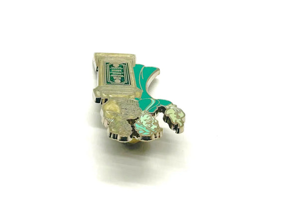 This pin is a 2012 Disney Parks Walt Disney World Haunted Mansion Interactive Graveyard Queue "Cousin Maude and Uncle Jacob's Statue" mystery pin.