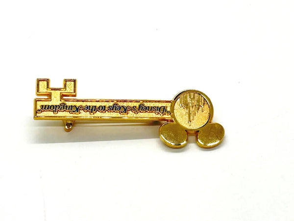 This enchanting gold-tone pin celebrates one of Disney's most exclusive experiences! This is a gold-tone souvenir pin given to guests who take the "Keys to the Kingdom" backstage walking tour at Magic Kingdom in Walt Disney World.