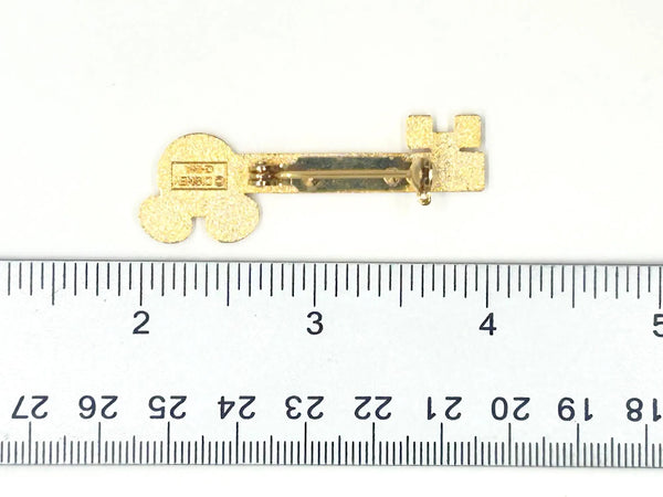 This enchanting gold-tone pin celebrates one of Disney's most exclusive experiences! This is a gold-tone souvenir pin given to guests who take the "Keys to the Kingdom" backstage walking tour at Magic Kingdom in Walt Disney World.