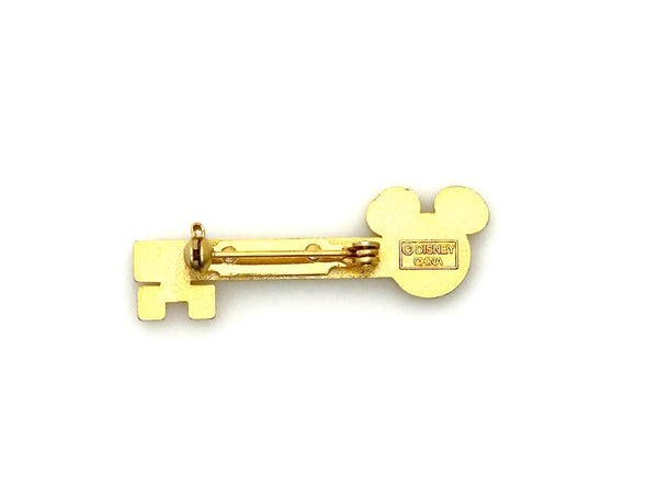 This enchanting gold-tone pin celebrates one of Disney's most exclusive experiences! This is a gold-tone souvenir pin given to guests who take the "Keys to the Kingdom" backstage walking tour at Magic Kingdom in Walt Disney World.