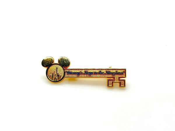 This enchanting gold-tone pin celebrates one of Disney's most exclusive experiences! This is a gold-tone souvenir pin given to guests who take the "Keys to the Kingdom" backstage walking tour at Magic Kingdom in Walt Disney World.