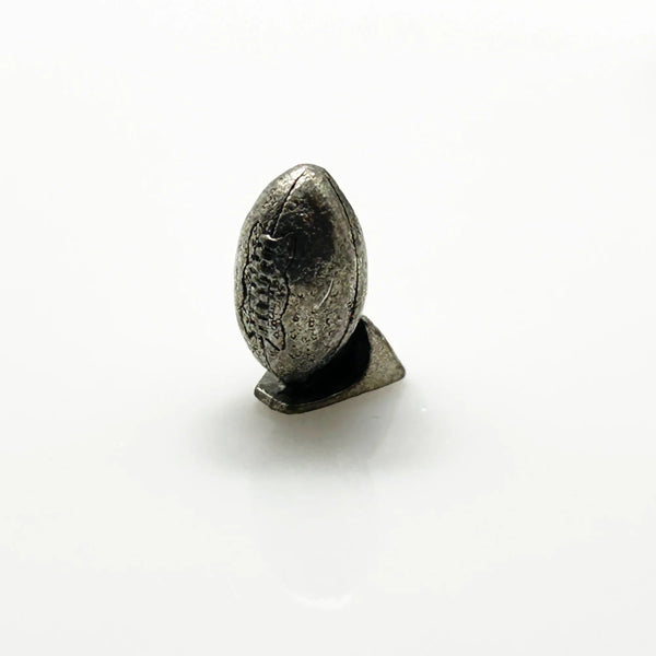 These are pewter tokens from a NFL Collector's Edition of the Monopoly board game, such as the 1998 or 2004 version.;The set includes miniature pewter figures of football players, a cheerleader, a football helmet, a football, and a whistle. I believe they were the Seattle Seahawks version.They are popular replacement parts for enthusiasts collecting specific themed Monopoly sets.