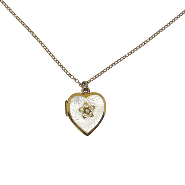 Mother of Pearl Heart Locket Necklace - Timeless vintage locket with a mother-of-pearl face and enamel flower detail. Heart-shaped and perfect for keepsakes. Shop now!
