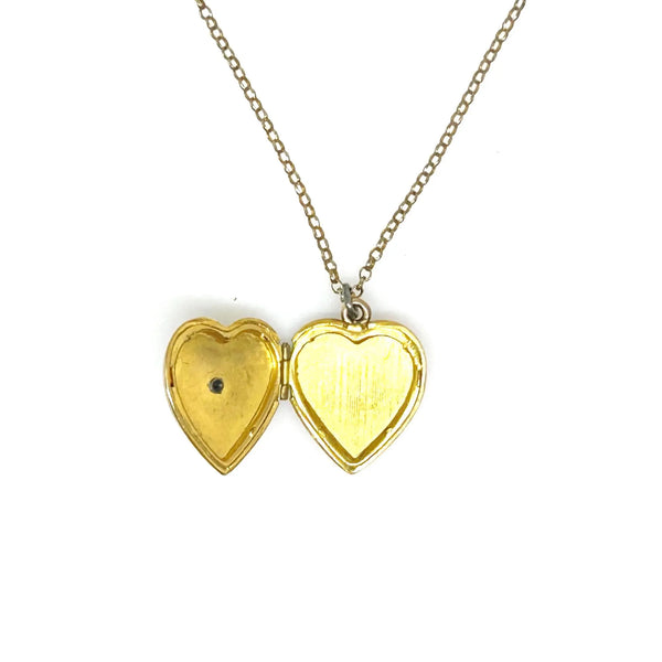 Mother of Pearl Heart Locket Necklace - Timeless vintage locket with a mother-of-pearl face and enamel flower detail. Heart-shaped and perfect for keepsakes. Shop now!