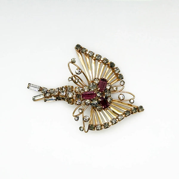 Introducing the M&amp;S 1/20 12kt G.F. Abstract Butterfly Brooch/Pendant — the perfect vintage solution to your style dilemmas. This exquisite butterfly brooch pendant highlights delicate abstract artistry paired with shimmering grey and purple/pink rhinestones