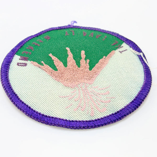 Commemorate a pivotal moment in natural history with this authentic Girl Scout Mount St. Helens patch from the early 1980s. Created in the wake of the volcano's catastrophic 1980 eruption, this Junior Girl Scout badge captures the dramatic geological event through embroidery—a volcano erupting in shades of pink against a serene blue-green sky.