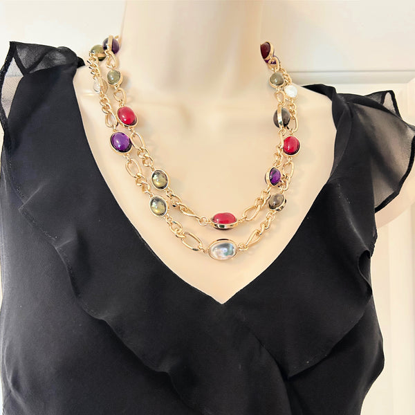 Vintage double strand station necklace with multicolor jewel-tone cabochons on a gold-tone chain link