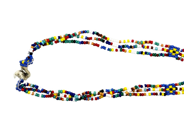 This is a striking example of vintage Native American-style hand-beaded necklace, featuring a loom-woven pendant of a female figure. These necklaces are handcrafted using colorful glass seed beads and often include traditional design elements such as looped fringe detail. These pieces are generally created using a flat, loom-woven technique