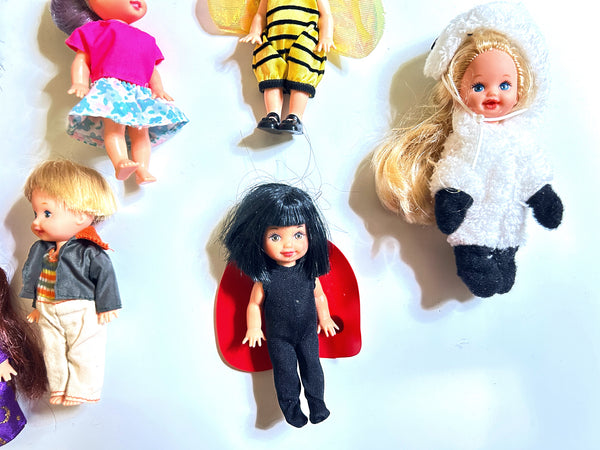 Assortment of five vintage Mattel Kelly Club 4-inch costume dolls, including a honeybee, ladybug, and lamb, displayed against a white background
