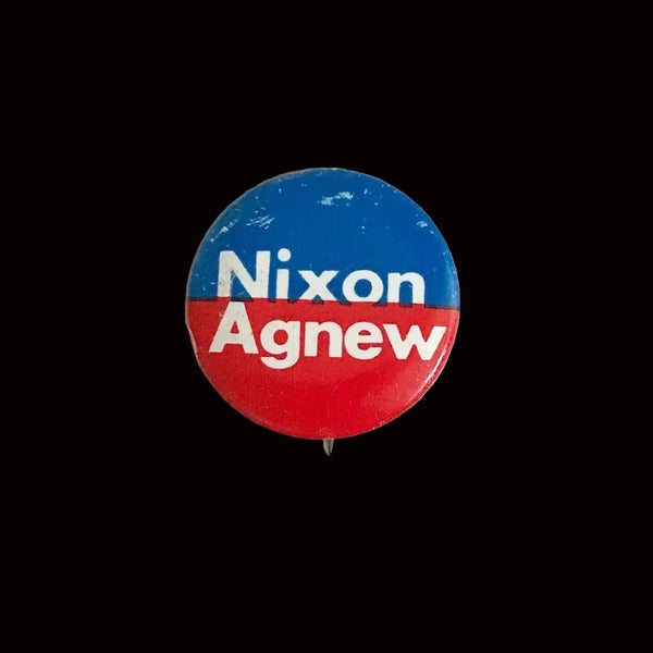 Celebrate a pivotal moment in American political history with the Nixon-Agnew Pin Back from the 1972 presidential campaign. Featuring bold red and blue colors with crisp white lettering, this vintage pin showcases the names of incumbent President Richard M. Nixon and Vice President Spiro Agnew, representing the Republican Party. 