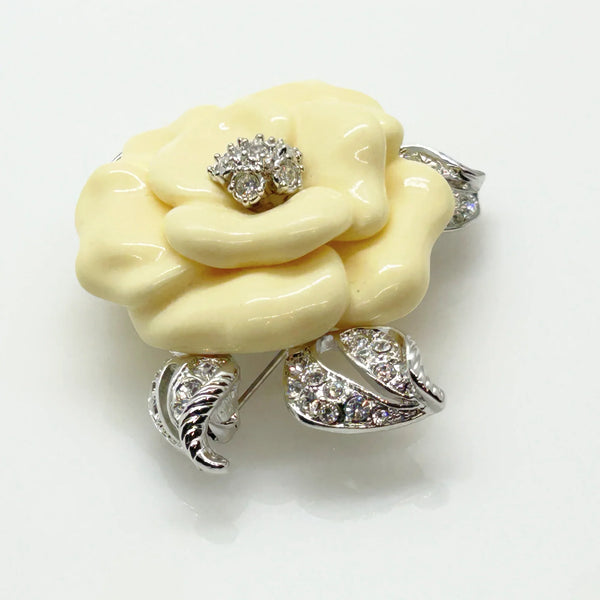 Perfect for those who appreciate timeless glamour: our Nolan Miller Lara Camellia Brooch provides a creamy flower brooch with sparkling elegance. Shop today!