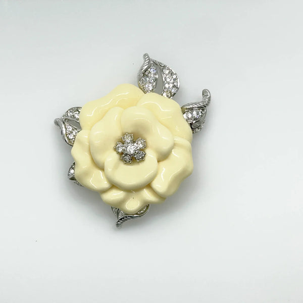 Perfect for those who appreciate timeless glamour: our Nolan Miller Lara Camellia Brooch provides a creamy flower brooch with sparkling elegance. Shop today!