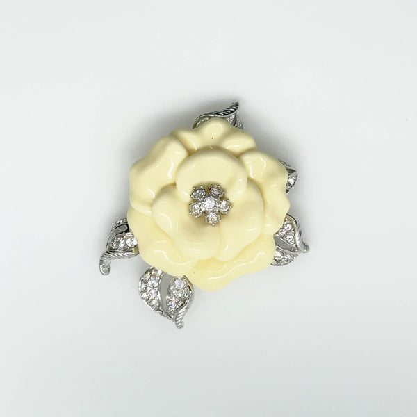 Perfect for those who appreciate timeless glamour: our Nolan Miller Lara Camellia Brooch provides a creamy flower brooch with sparkling elegance. Shop today!