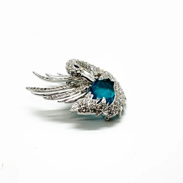 Perfect for collectors and style enthusiasts: our Showstopper Brooch provides timeless elegance and a stunning sculptural swan design. Shop today!