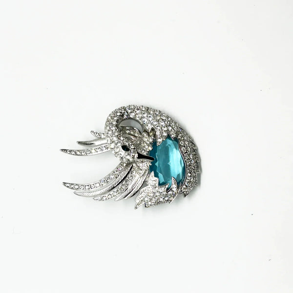 Perfect for collectors and style enthusiasts: our Showstopper Brooch provides timeless elegance and a stunning sculptural swan design. Shop today!